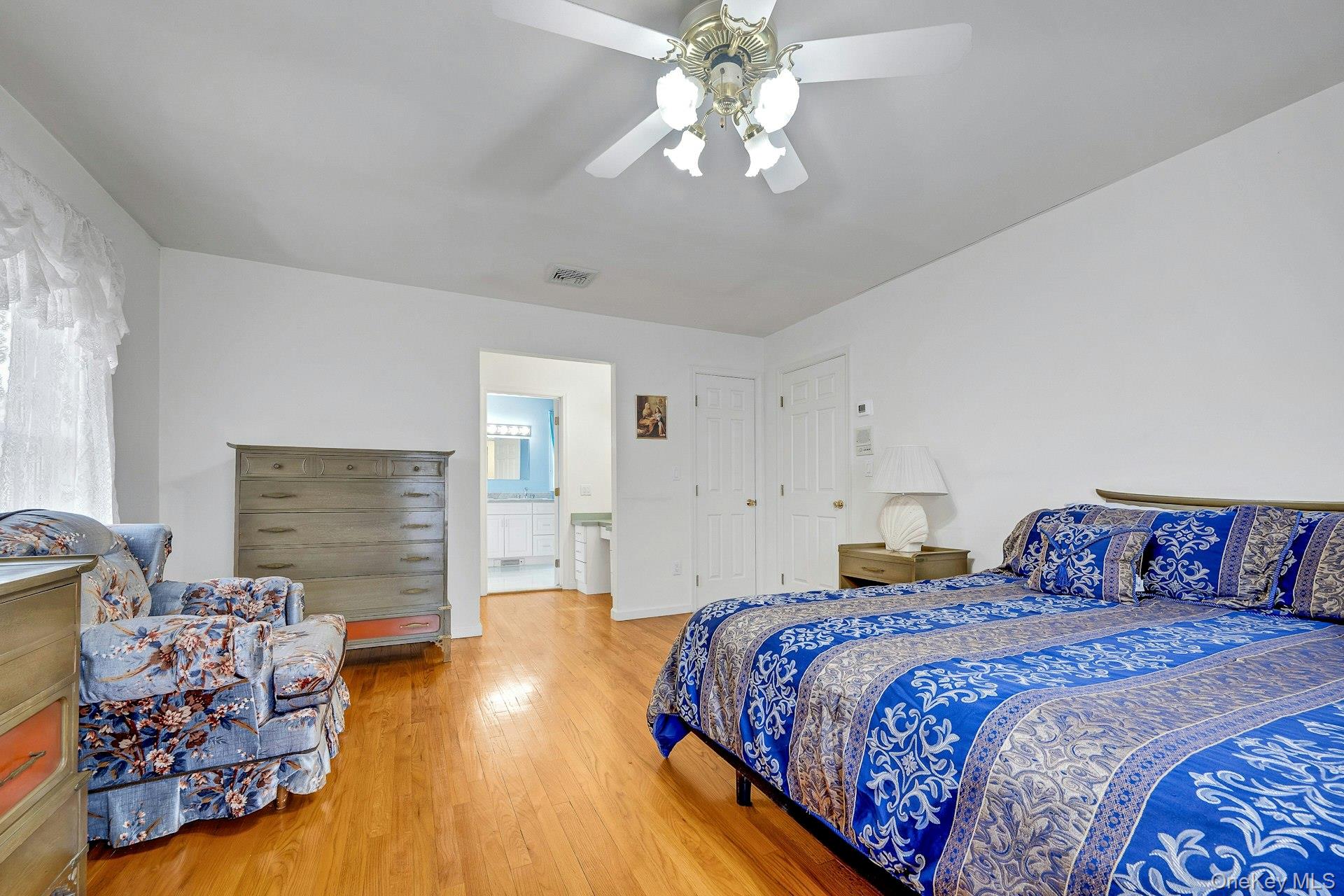 97 Bradley Road Scarsdale, NY 10583 - Photo 14 of 27 a bedroom with a bed and wooden floor