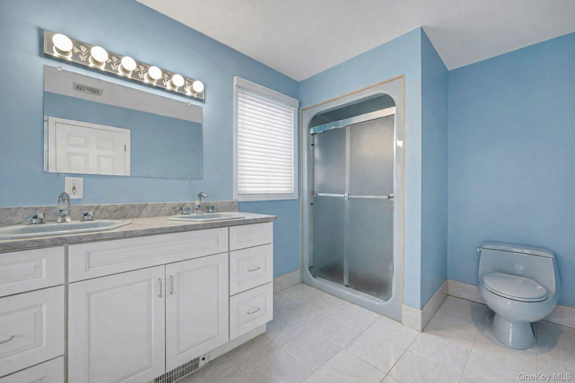 97 Bradley Road Scarsdale, NY 10583 - Photo 16 of 27 a bathroom with a toilet sink and mirror