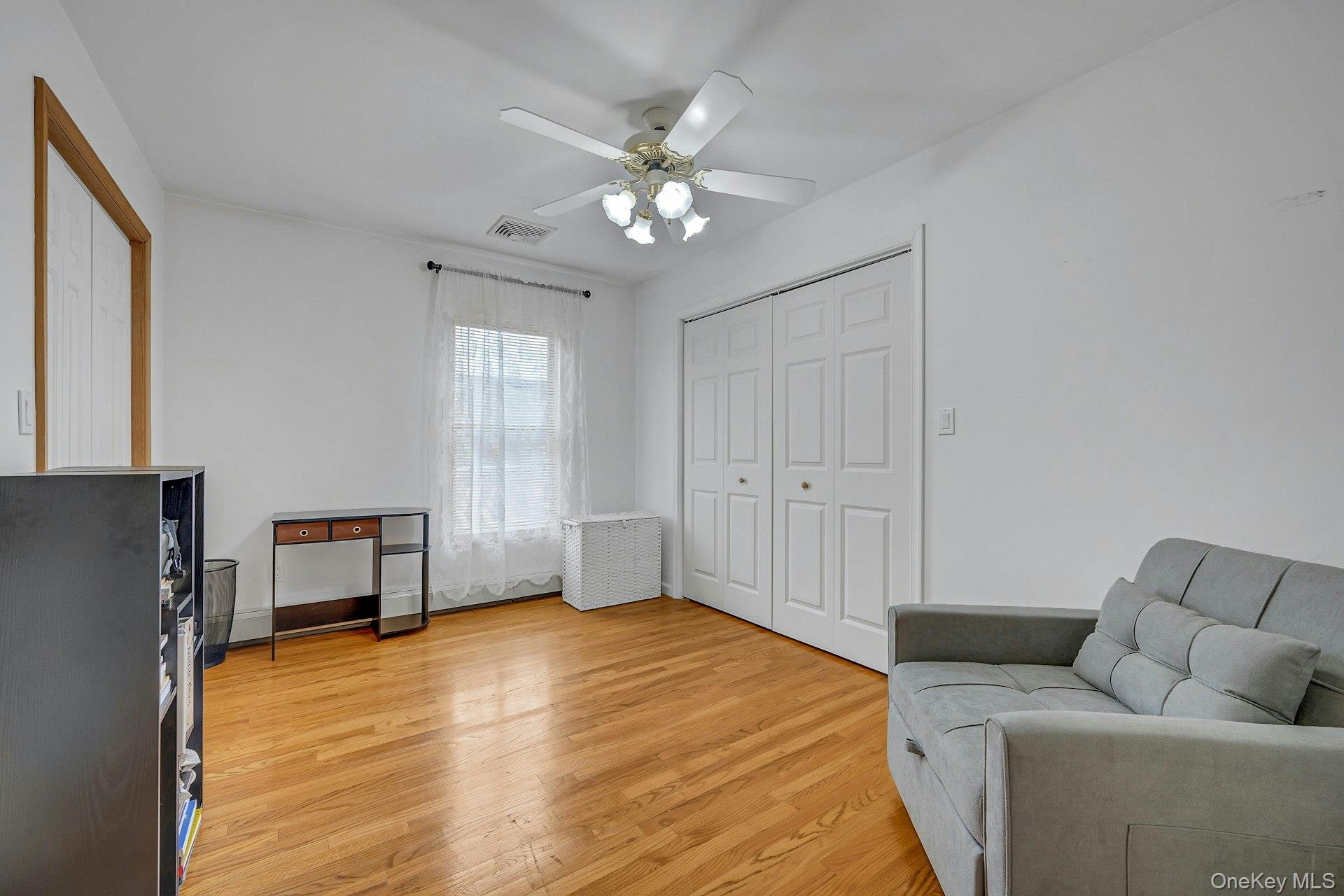 97 Bradley Road Scarsdale, NY 10583 - Photo 17 of 27 a living room with furniture and a ceiling fan