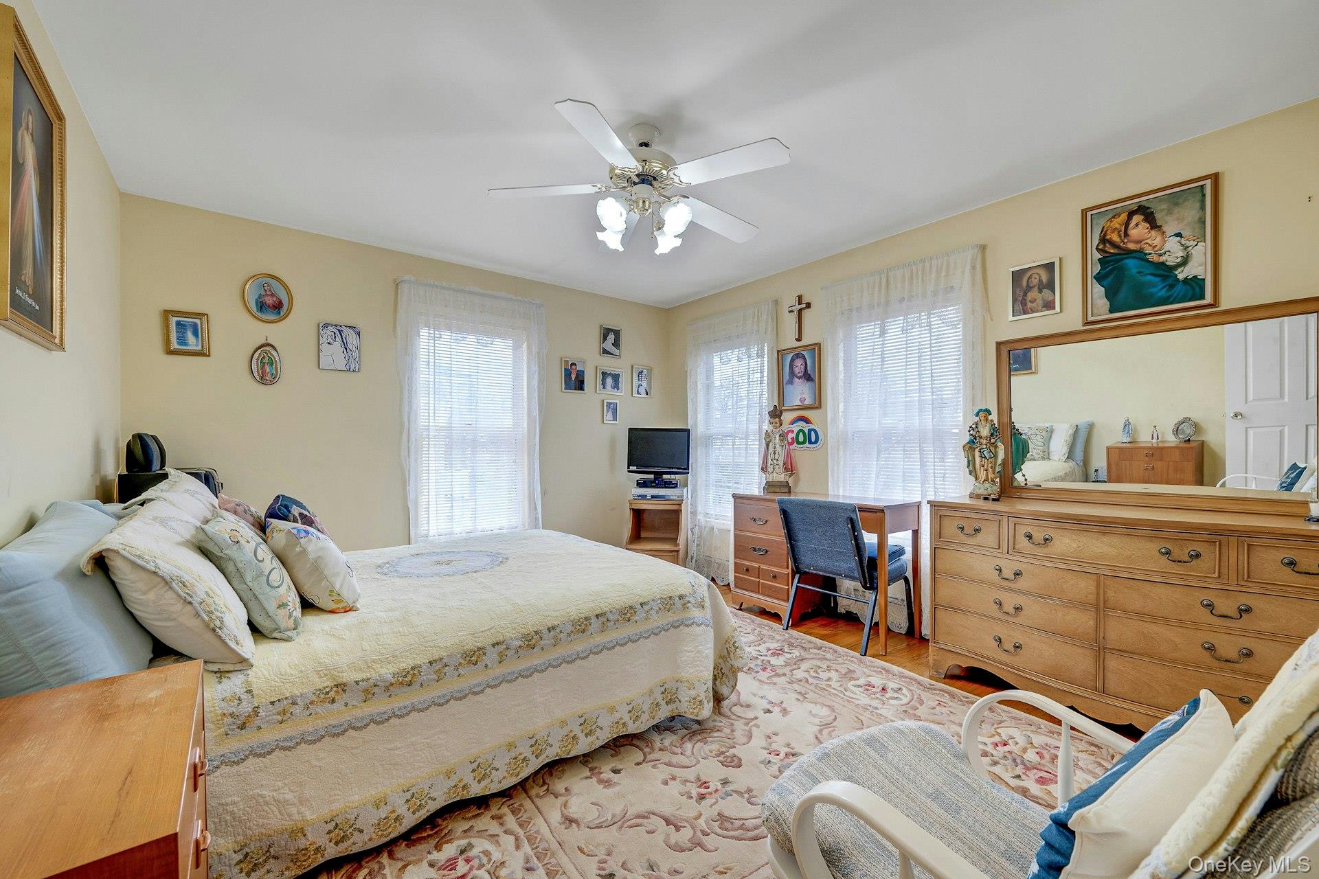 97 Bradley Road Scarsdale, NY 10583 - Photo 18 of 27 a bedroom with a bed and wooden floor