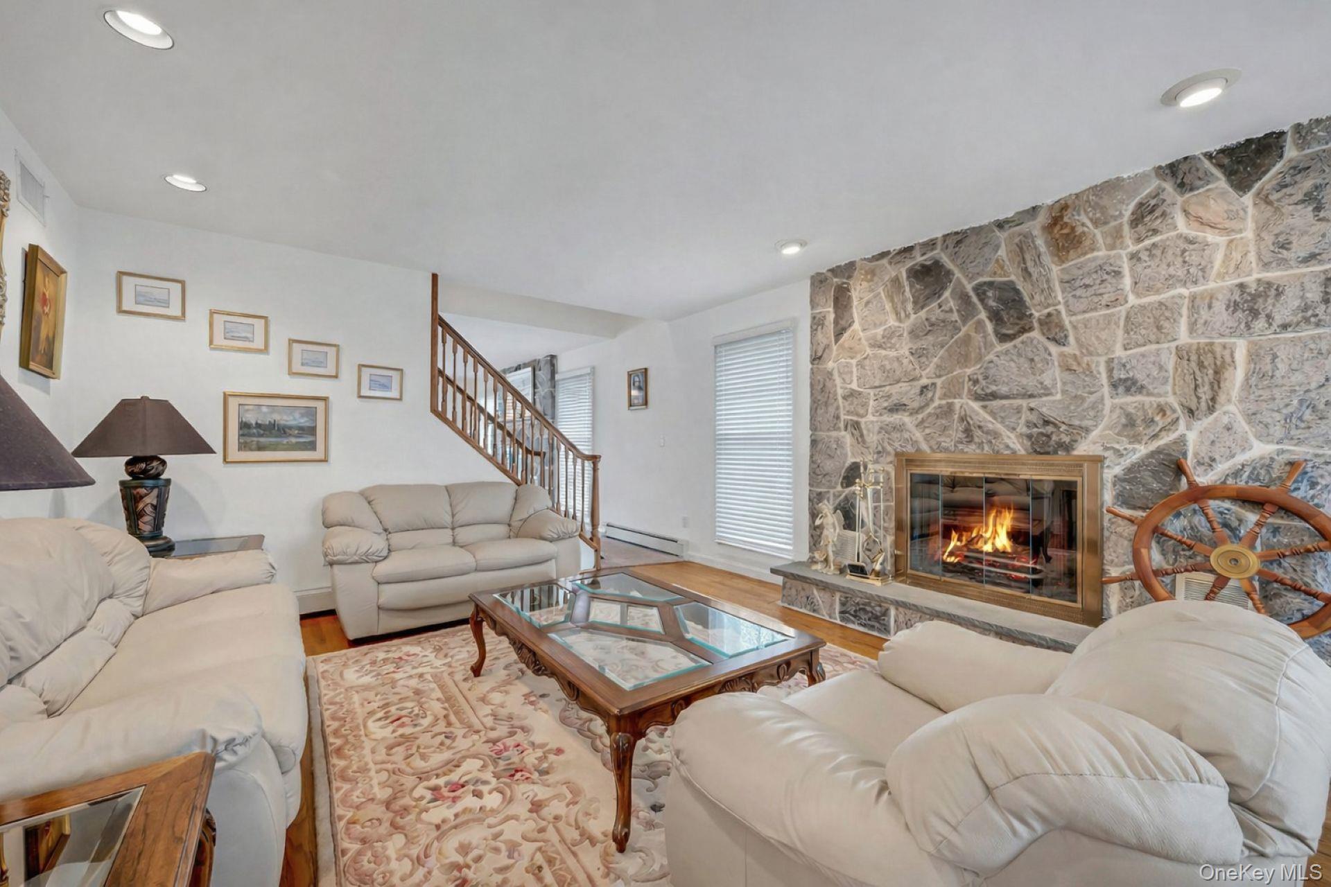 97 Bradley Road Scarsdale, NY 10583 - Photo 4 of 27 a living room with furniture and a fireplace