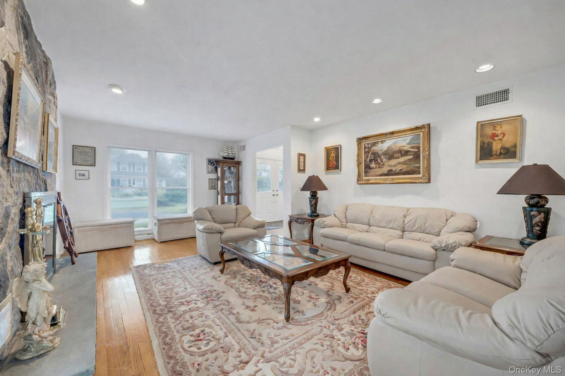 97 Bradley Road Scarsdale, NY 10583 - Photo 5 of 27 a living room with furniture and a large window