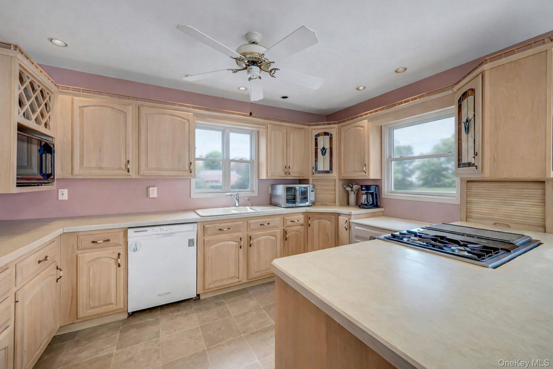97 Bradley Road Scarsdale, NY 10583 - Photo 7 of 27 a kitchen with granite countertop a sink stainless steel appliances and cabinets