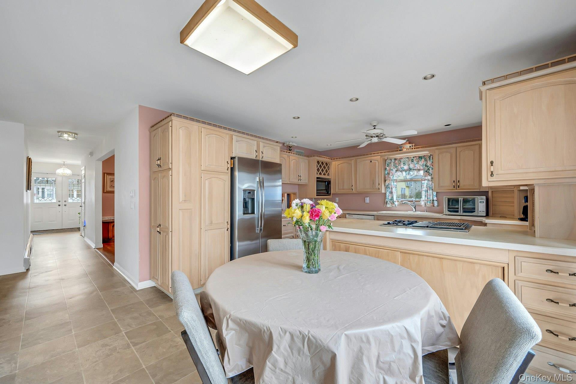 97 Bradley Road Scarsdale, NY 10583 - Photo 10 of 27 a kitchen with stainless steel appliances granite countertop a sink refrigerator and cabinets