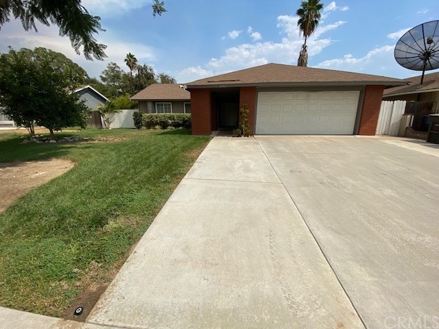 1252 Turley Street Riverside, CA 92501 - Photo 1 of 1 a front view of a house with a yard and potted plants