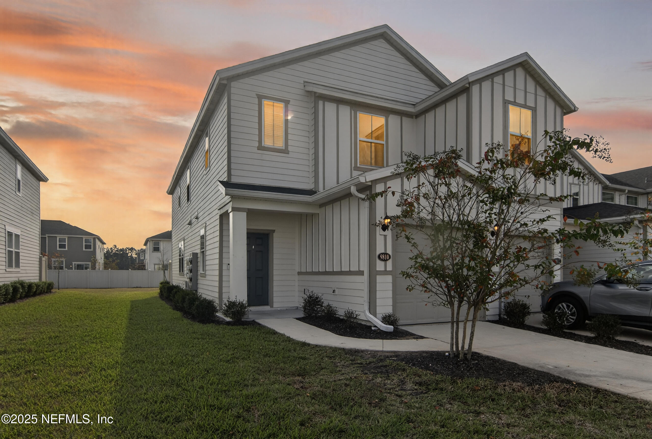 a front view of a house with a yard