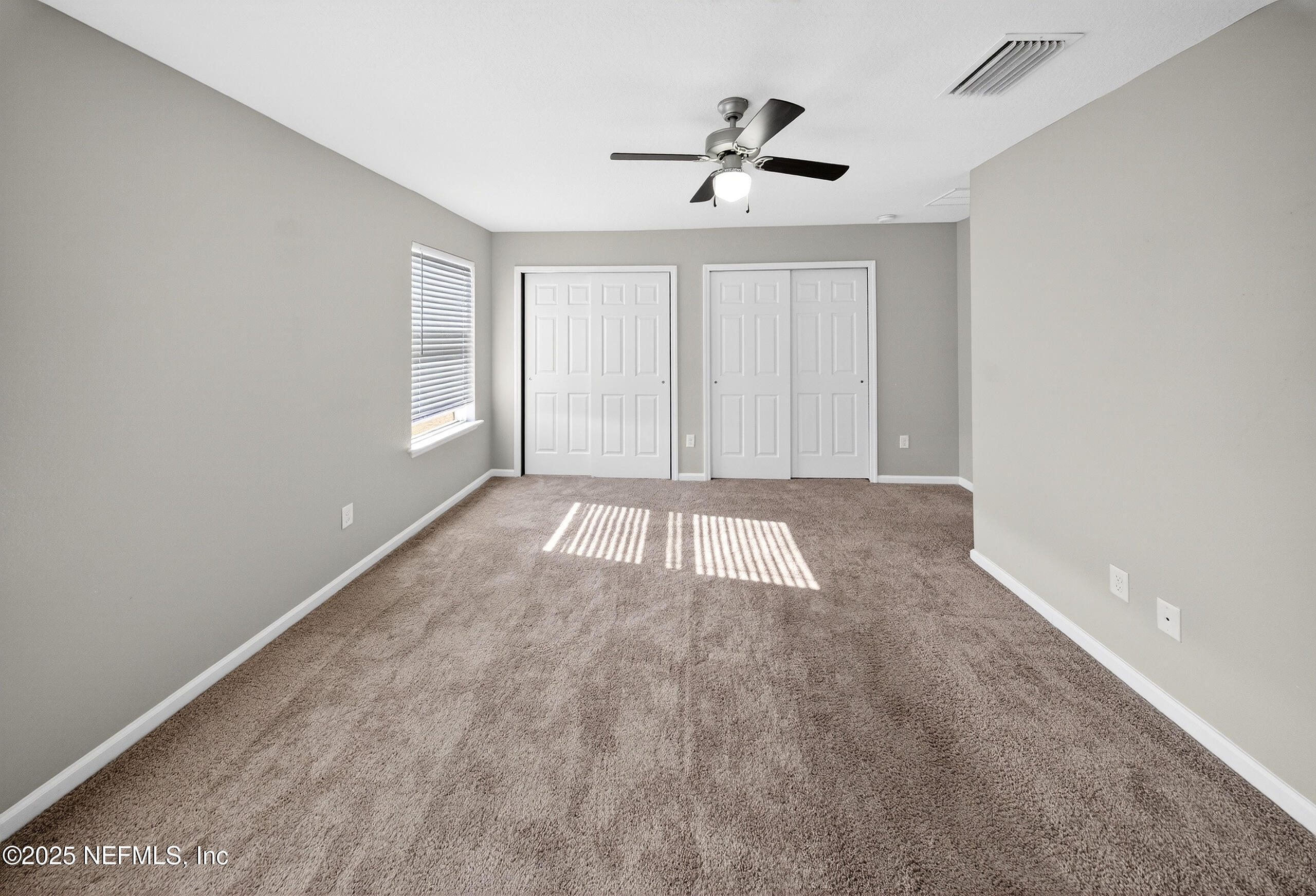 9810 Fiddleback Lane Jacksonville, FL 32222 - Photo 17 of 20 a view of empty room with windows