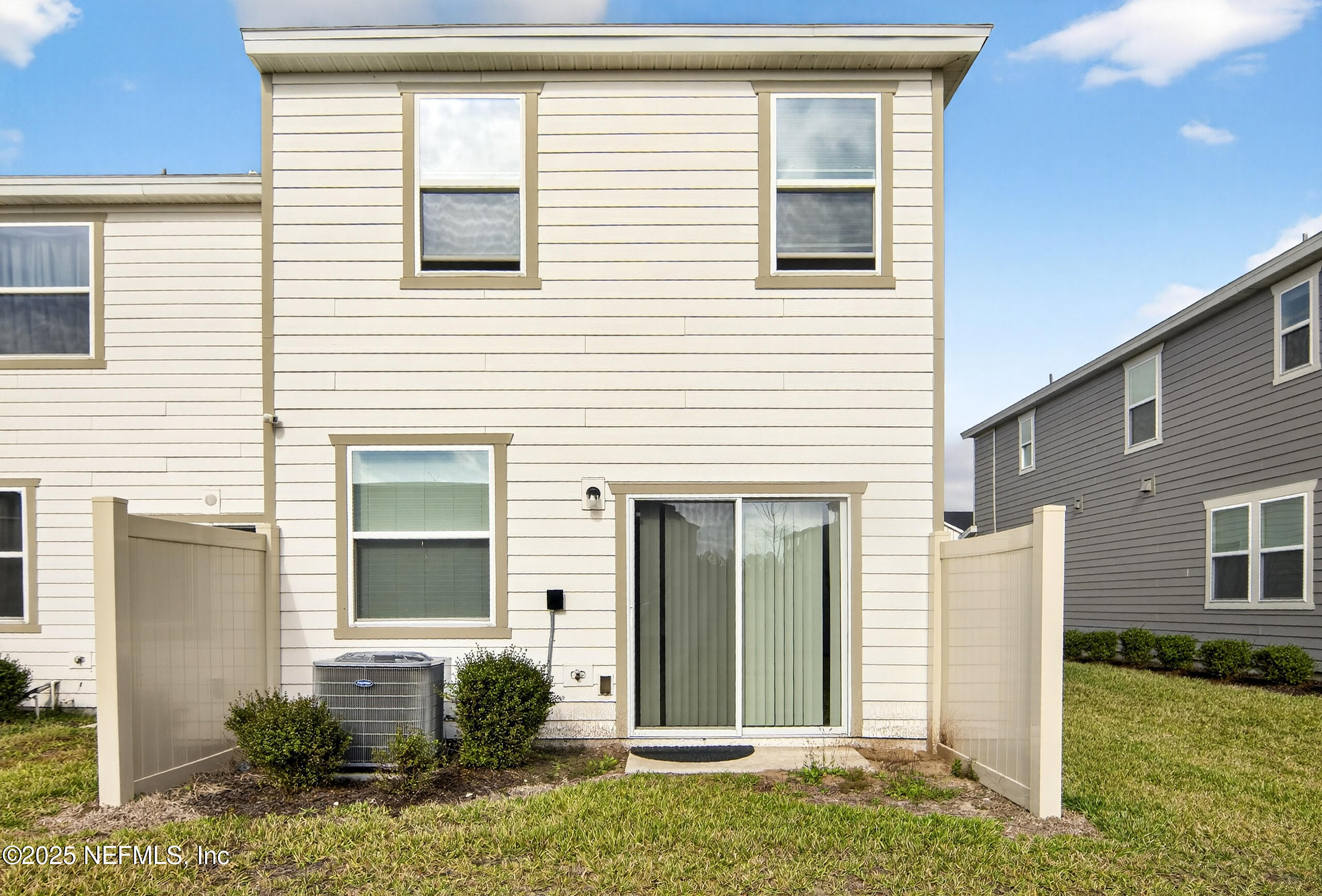 9810 Fiddleback Lane Jacksonville, FL 32222 - Photo 18 of 20 a view of a house with a yard