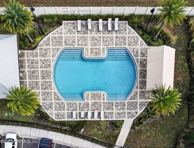 a view of a chairs and table in the balcony