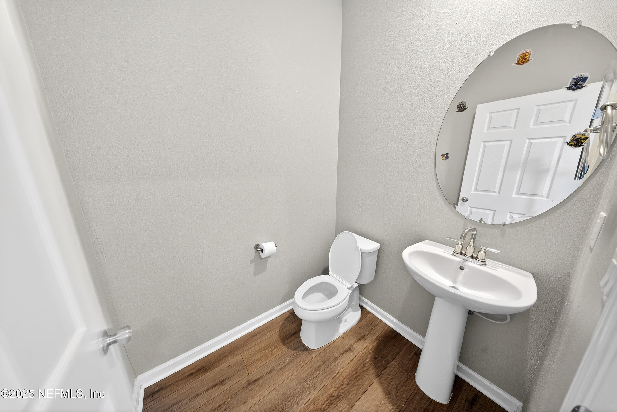 9810 Fiddleback Lane Jacksonville, FL 32222 - Photo 6 of 20 a bathroom with a sink mirror and toilet