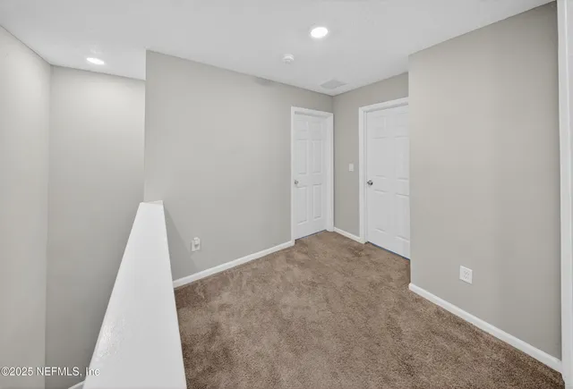 a view of a room with a hallway