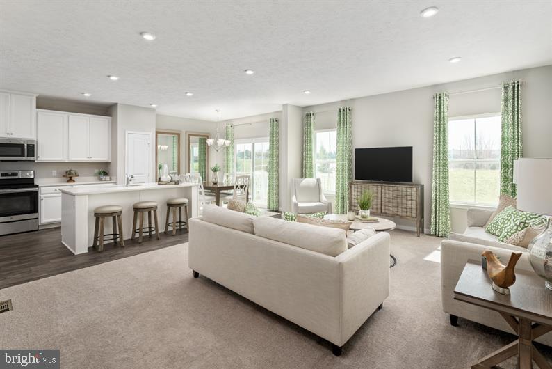 351 Piper Lane Exton, PA 19341 - Photo 5 of 10 Family Room View to Kitchen & Dining Space