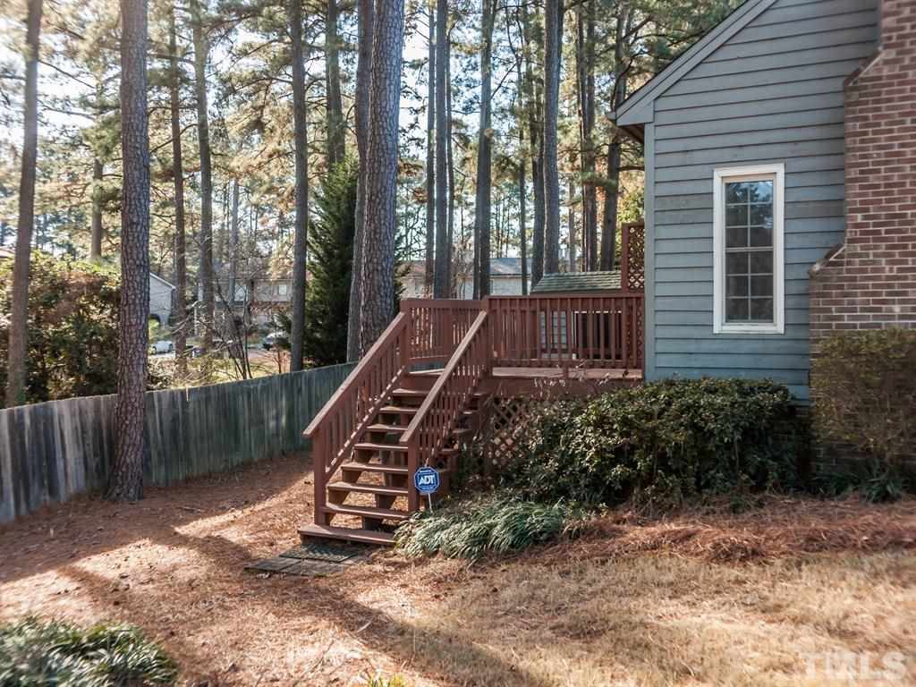 934 Albany Court Raleigh, NC 27615 - Photo 22 of 25 a view of a house with backyard and trees