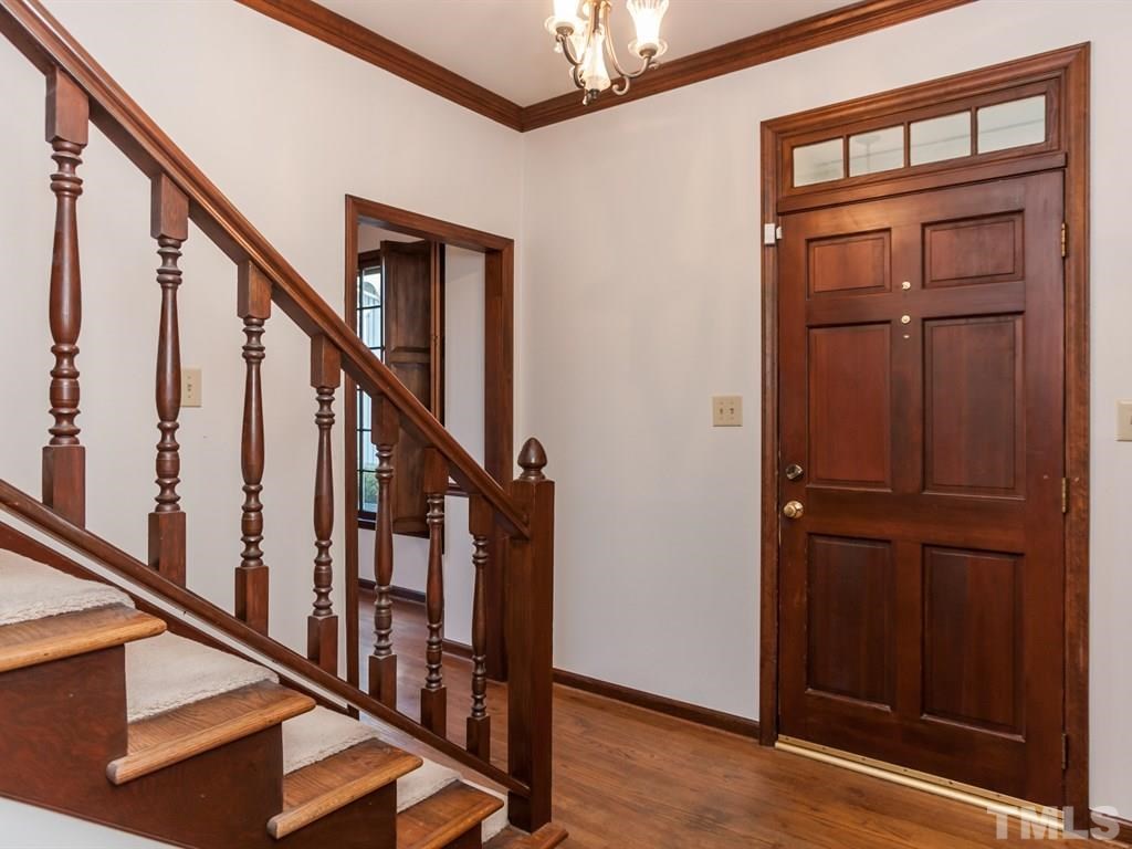 934 Albany Court Raleigh, NC 27615 - Photo 4 of 25 a view of an entryway with wooden floor and door