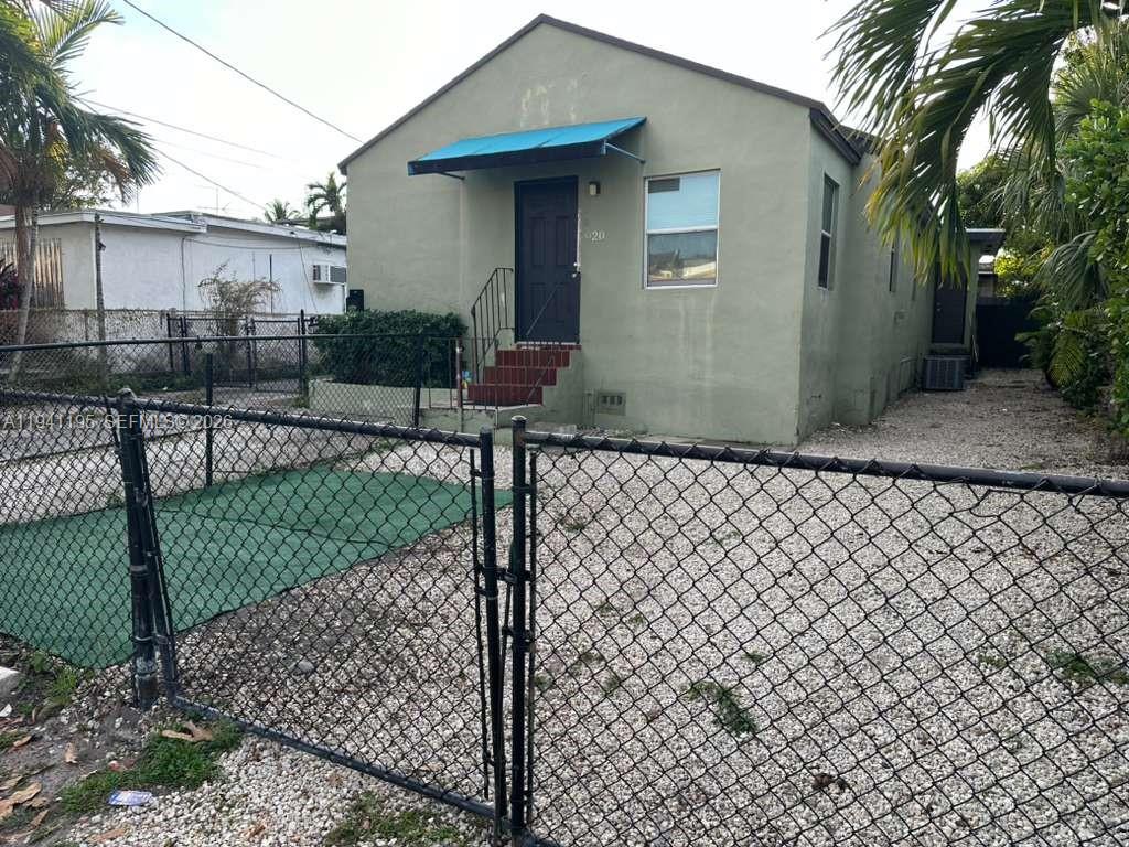 a front view of a house having yard