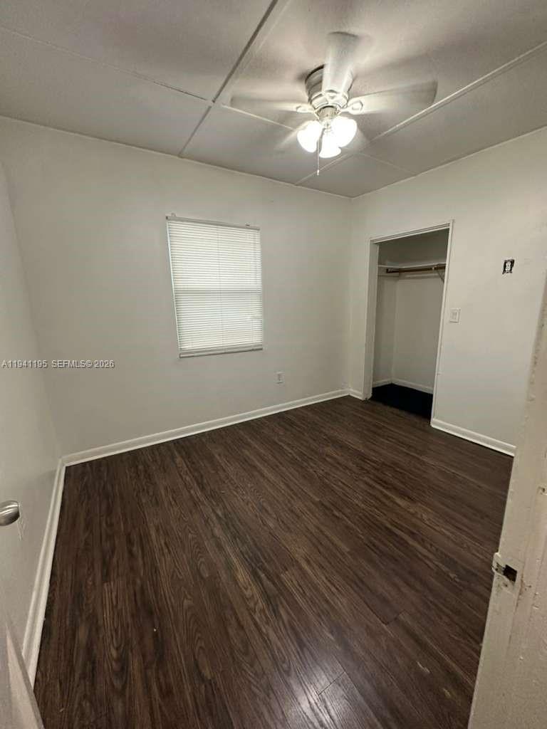 920 Northwest 22nd Court, Unit 920 Miami, FL 33125 - Photo 17 of 28 wooden floor in an empty room with a window