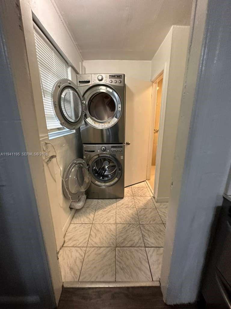 920 Northwest 22nd Court, Unit 920 Miami, FL 33125 - Photo 23 of 28 a utility room with dryer and washer