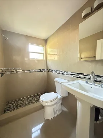 a bathroom with a sink and a toilet