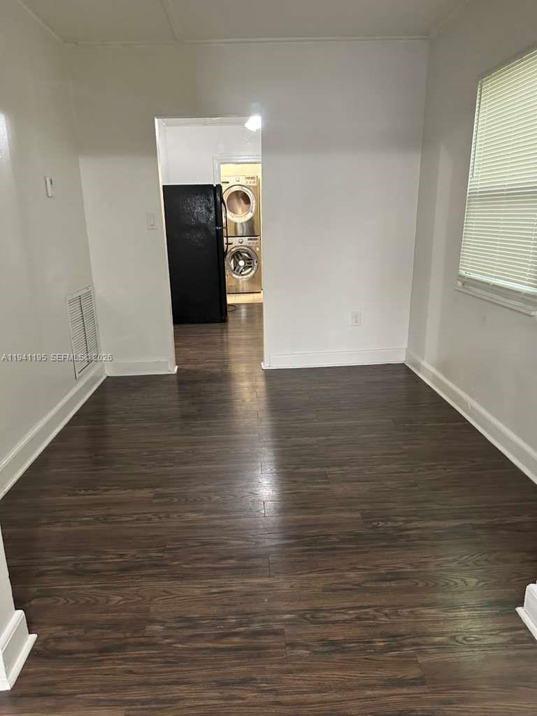 920 Northwest 22nd Court, Unit 920 Miami, FL 33125 - Photo 8 of 28 a view of a hallway with wooden floor and a fireplace
