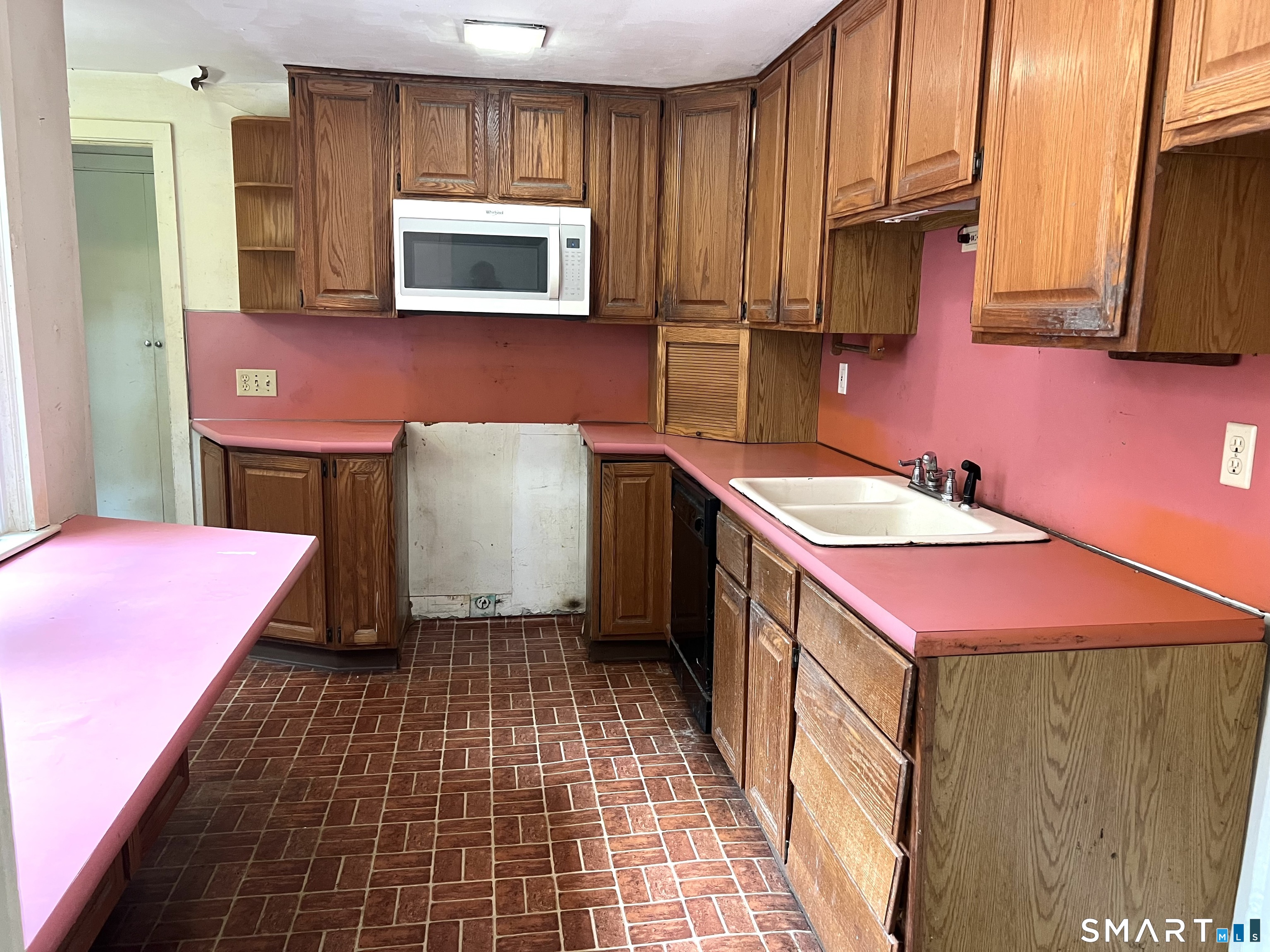 75 Black Rock Road Watertown, CT 06795 - Photo 8 of 24 a kitchen with a sink cabinets and microwave