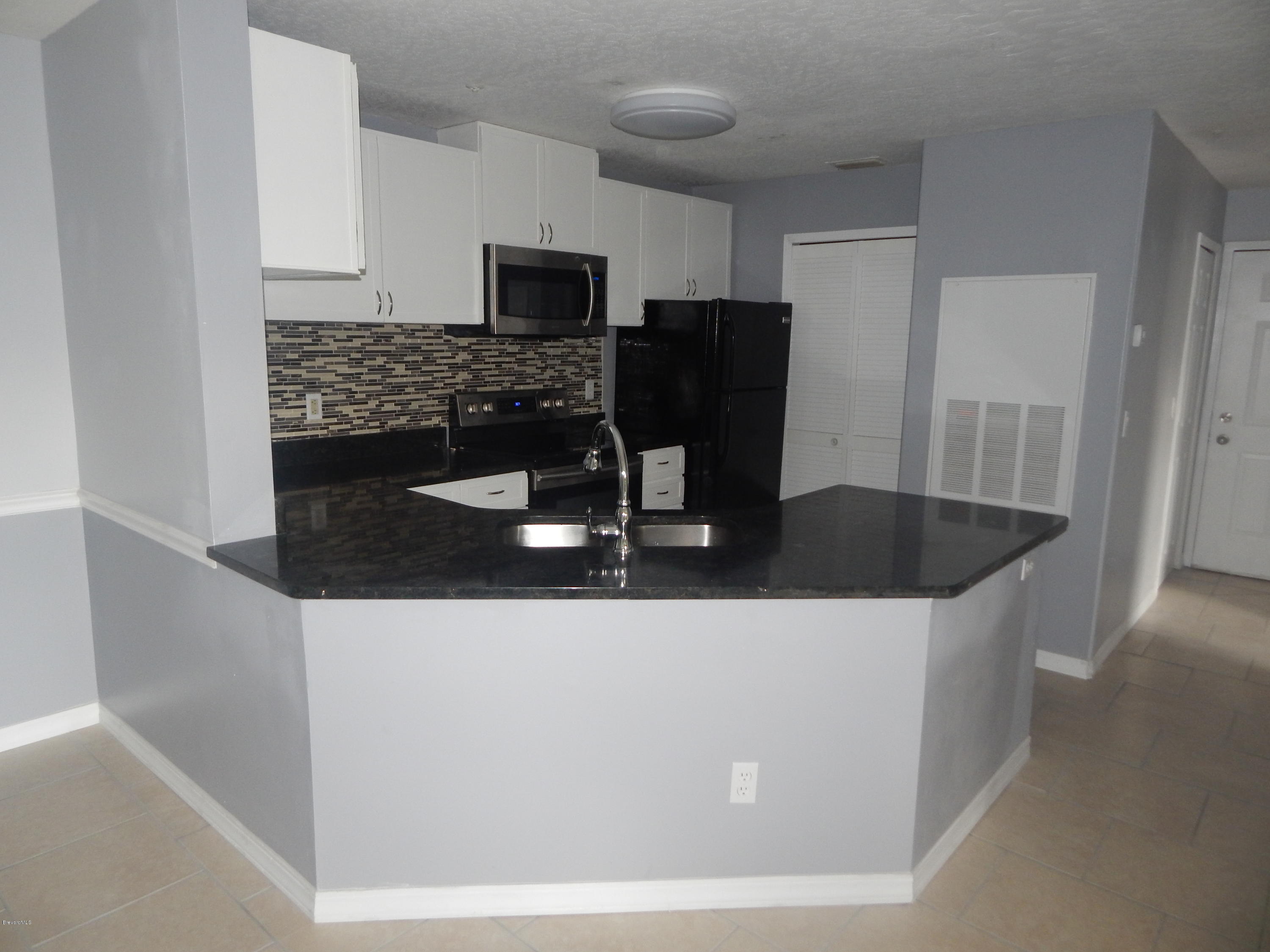 7667 North Wickham Road, Unit 112 Melbourne, FL 32940 - Photo 2 of 17 KITCHEN