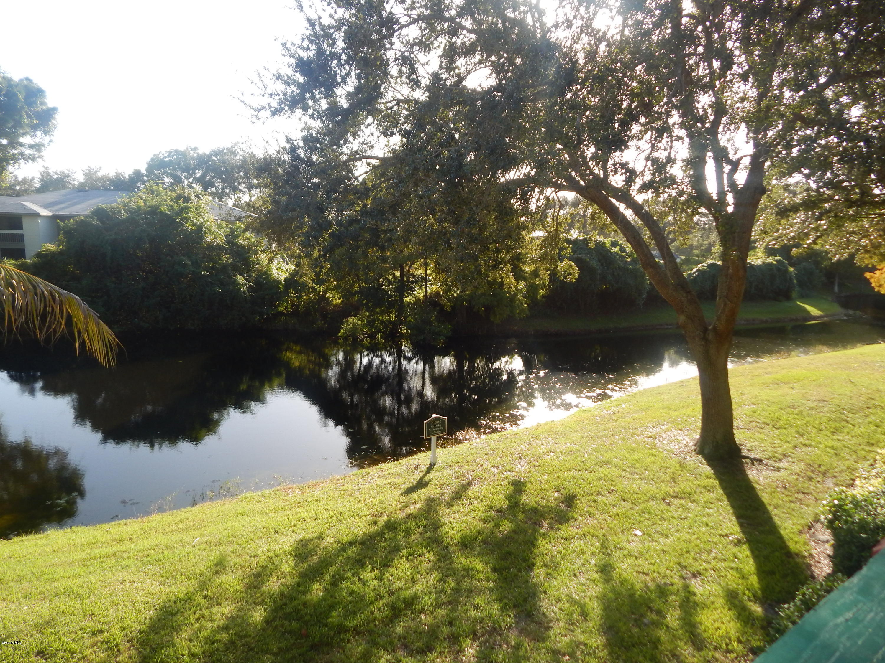 7667 North Wickham Road, Unit 112 Melbourne, FL 32940 - Photo 13 of 17 POND VIEW FROM BALCONY