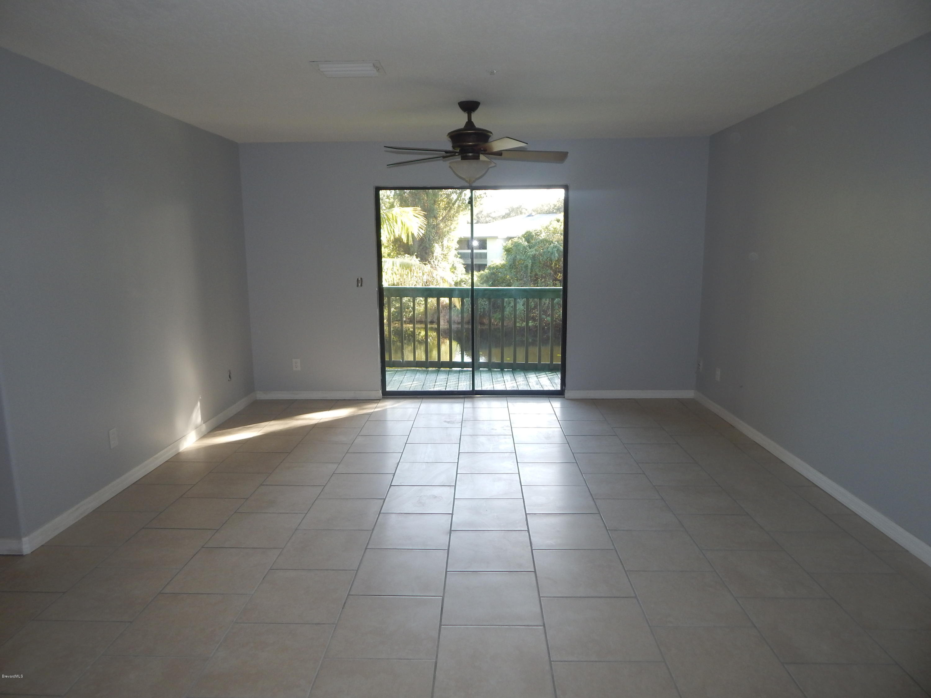 7667 North Wickham Road, Unit 112 Melbourne, FL 32940 - Photo 3 of 17 LIVING ROOM