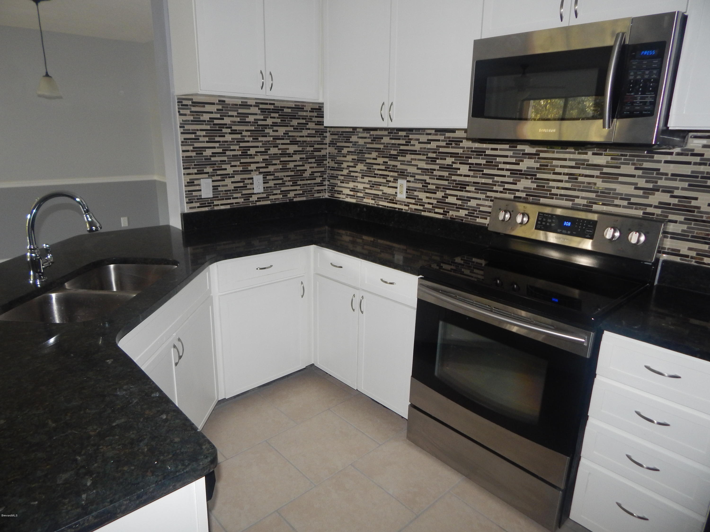 7667 North Wickham Road, Unit 112 Melbourne, FL 32940 - Photo 5 of 17 KITCHEN