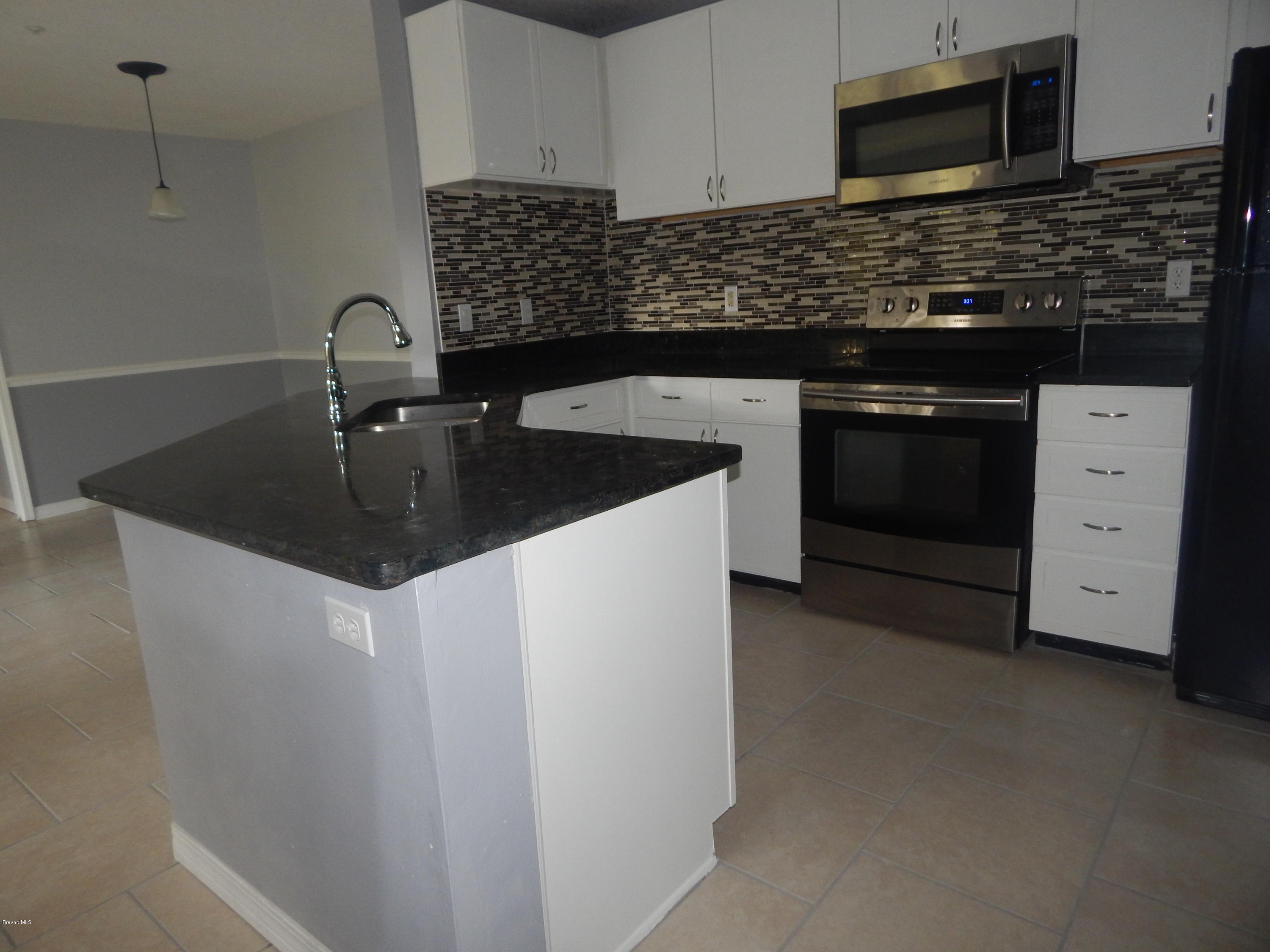 7667 North Wickham Road, Unit 112 Melbourne, FL 32940 - Photo 6 of 17 KITCHEN