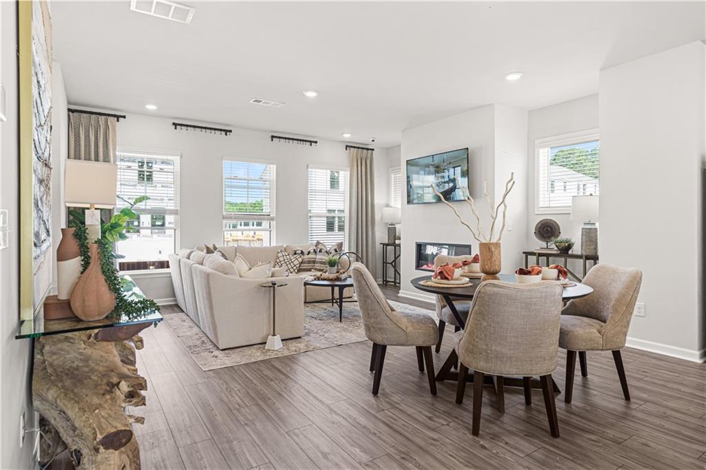 66 Wilder Ridge Way Lawrenceville, GA 30044 - Photo 17 of 44 a view of a dining room with furniture window and wooden floor