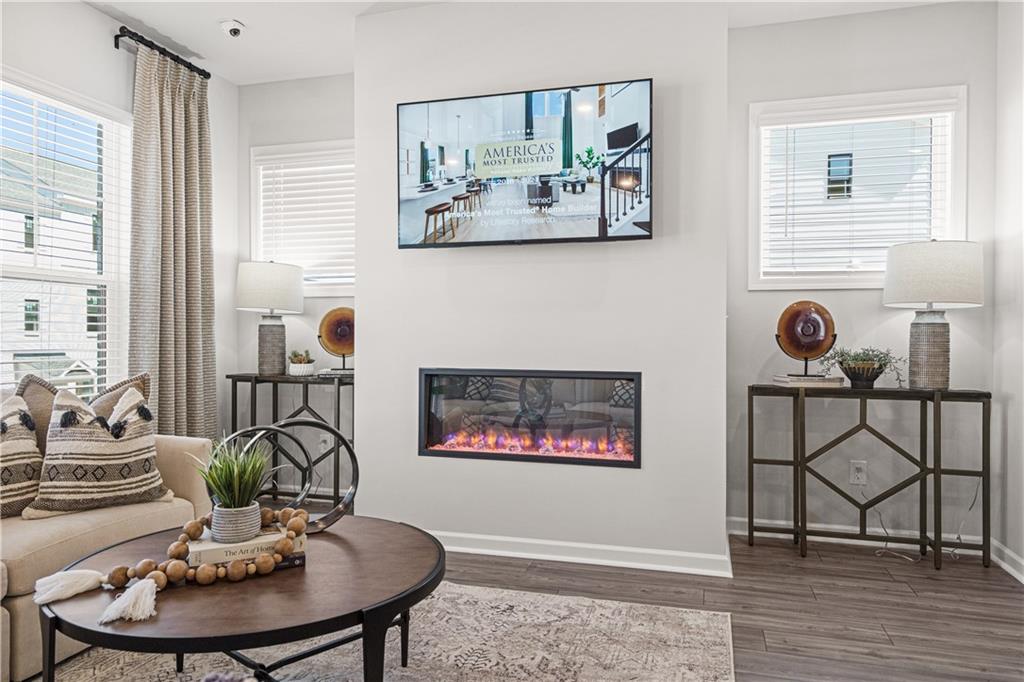 66 Wilder Ridge Way Lawrenceville, GA 30044 - Photo 19 of 44 a view of a dining room with furniture and wooden floor