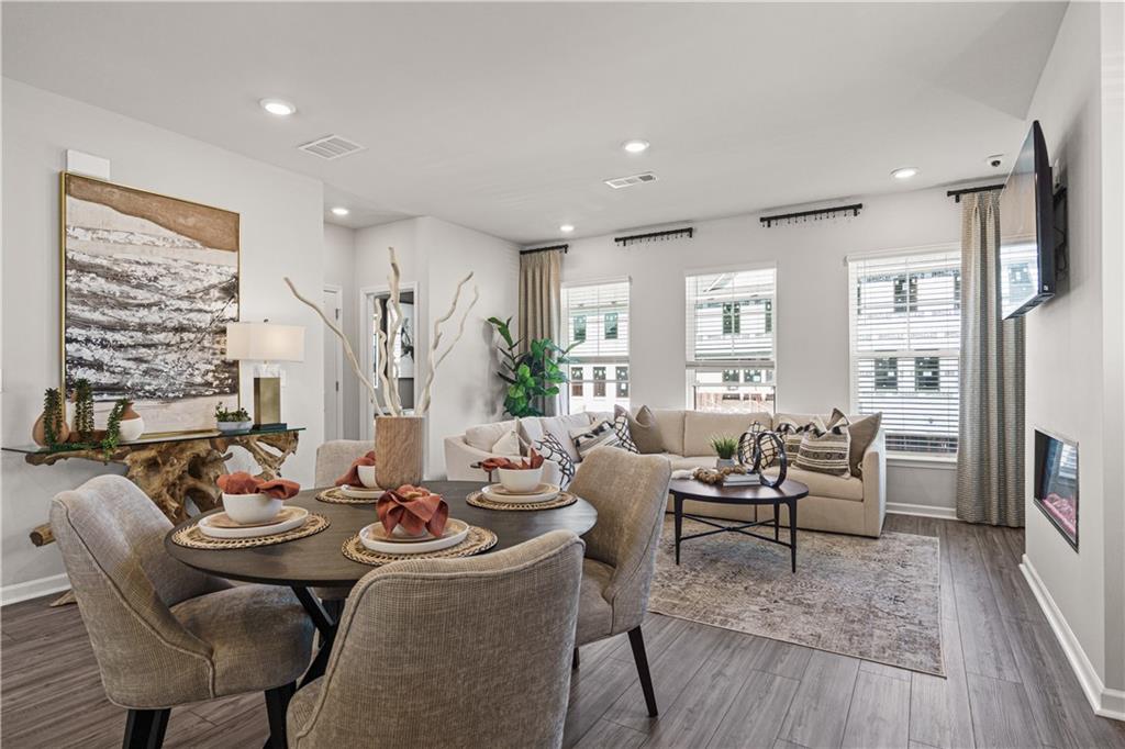 66 Wilder Ridge Way Lawrenceville, GA 30044 - Photo 22 of 44 a view of a dining room with furniture window and wooden floor