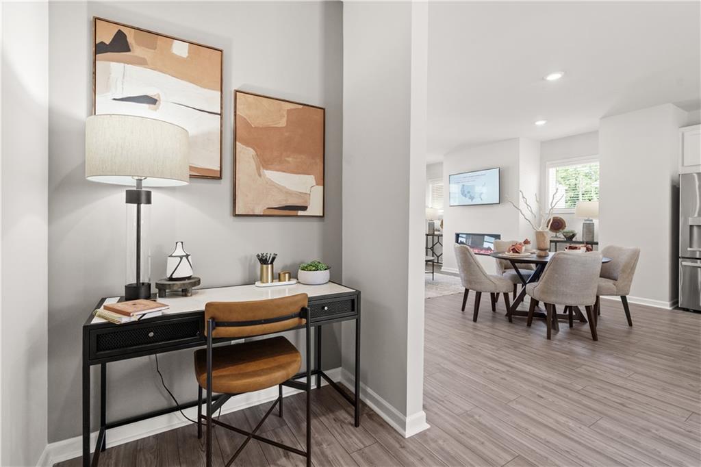 66 Wilder Ridge Way Lawrenceville, GA 30044 - Photo 23 of 44 a view of a dining room with furniture and wooden floor