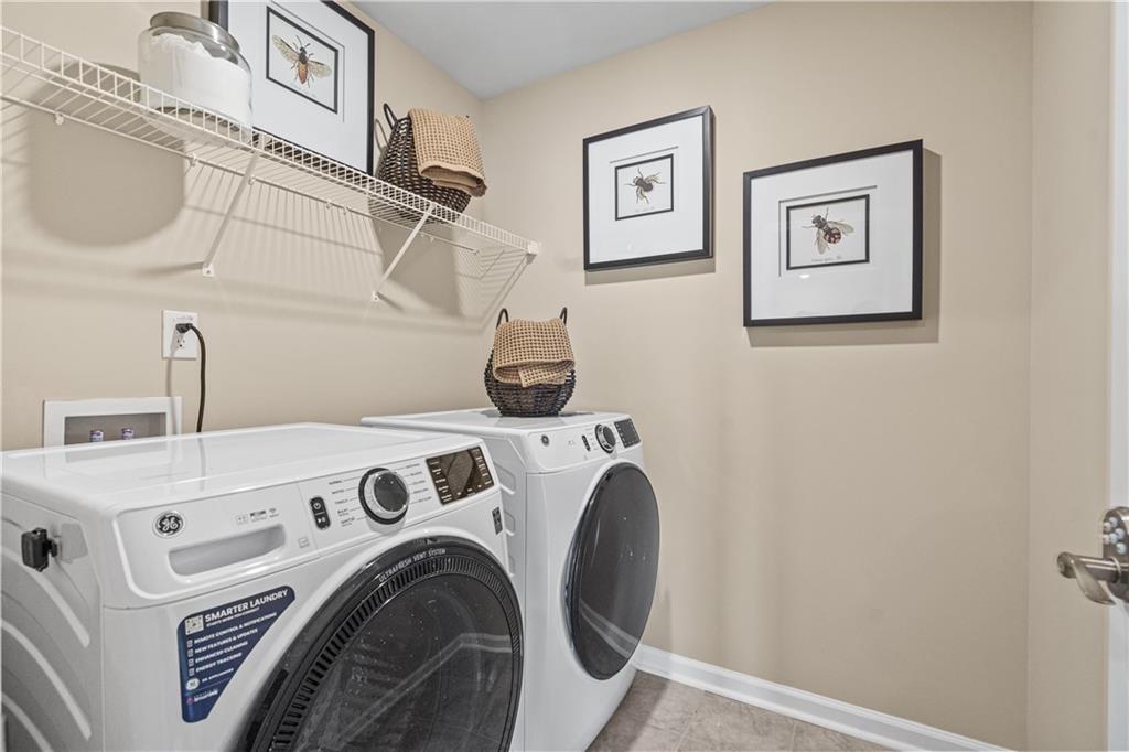 66 Wilder Ridge Way Lawrenceville, GA 30044 - Photo 25 of 44 a utility room with dryer and washer