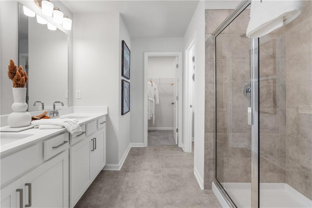 66 Wilder Ridge Way Lawrenceville, GA 30044 - Photo 28 of 44 a bathroom with a double vanity sink mirror and shower