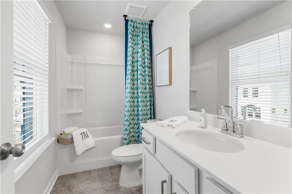 66 Wilder Ridge Way Lawrenceville, GA 30044 - Photo 31 of 44 a bathroom with a sink toilet and shower