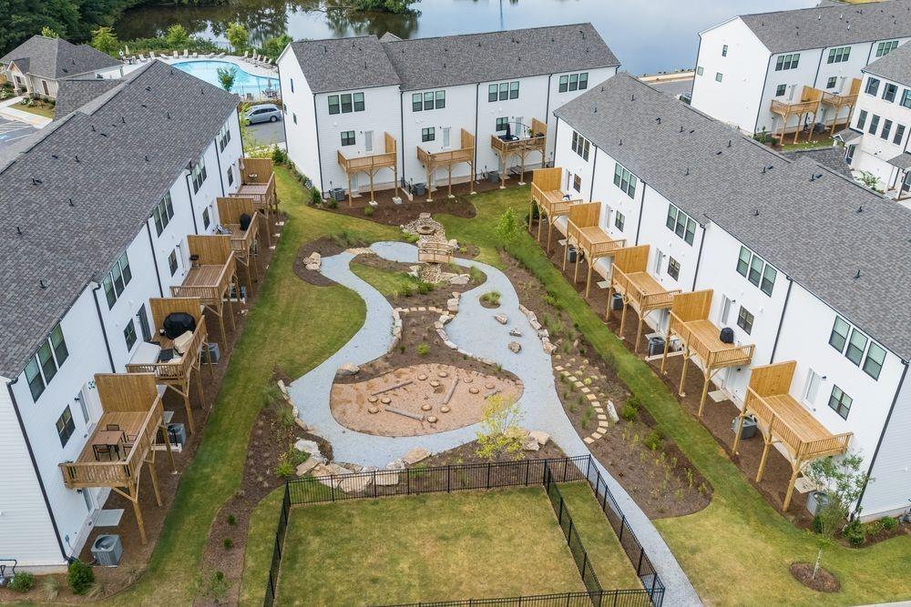 66 Wilder Ridge Way Lawrenceville, GA 30044 - Photo 34 of 44 an aerial view of residential houses with outdoor space