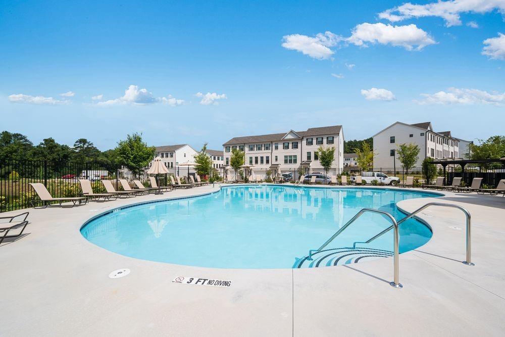 66 Wilder Ridge Way Lawrenceville, GA 30044 - Photo 41 of 44 a view of a swimming pool with a table and chairs
