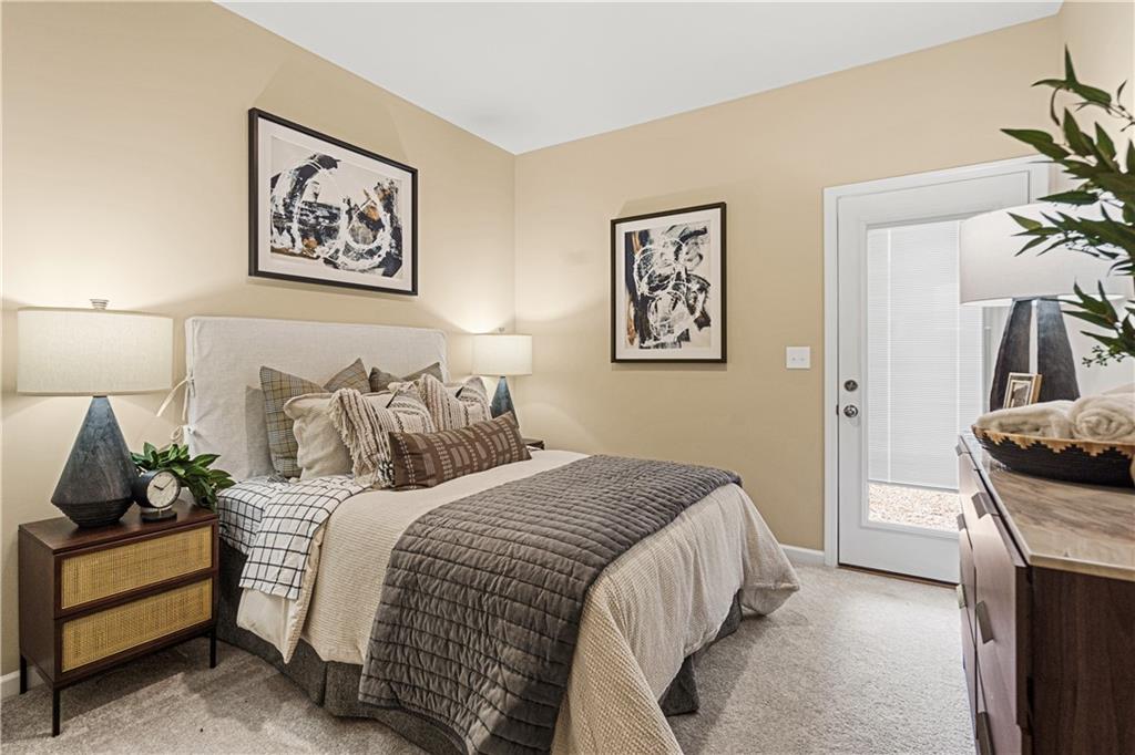 66 Wilder Ridge Way Lawrenceville, GA 30044 - Photo 6 of 44 a bedroom with bed and cupboard