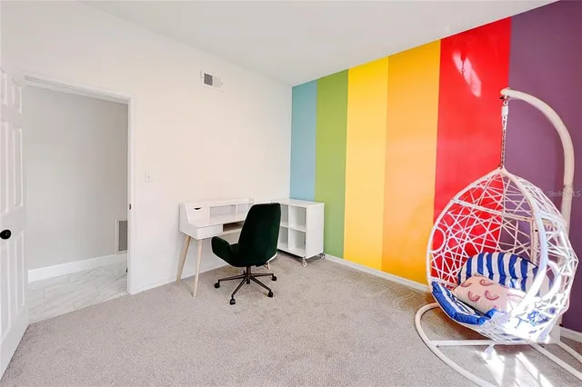 a view of a workspace with furniture