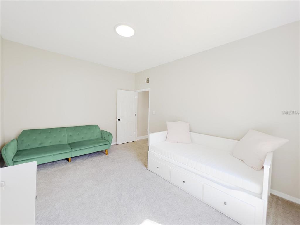 3273 Furlong Way Gotha, FL 34734 - Photo 17 of 38 a room with a bed and green walls