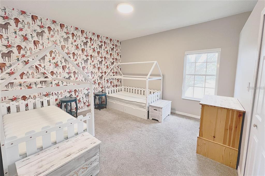 3273 Furlong Way Gotha, FL 34734 - Photo 21 of 38 a living room with furniture and a gate