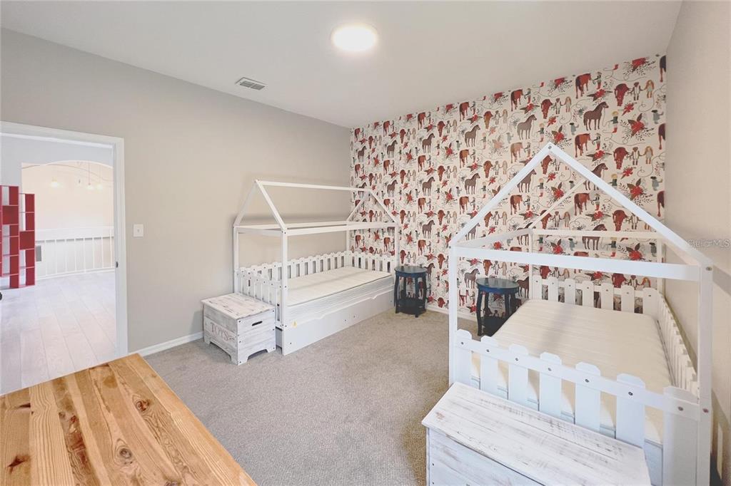 3273 Furlong Way Gotha, FL 34734 - Photo 22 of 38 a bedroom with furniture and a wooden floor