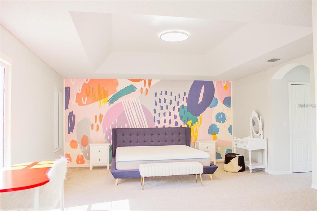 3273 Furlong Way Gotha, FL 34734 - Photo 24 of 38 a bedroom with a bed and a couch