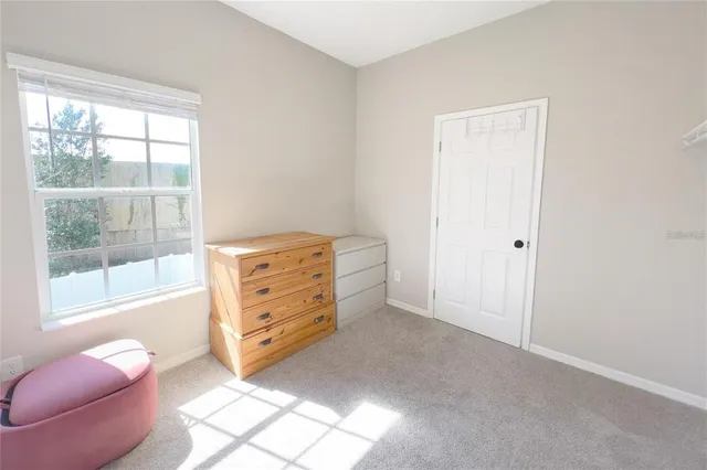 a view of room with furniture and windows