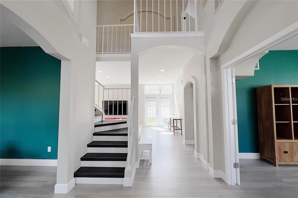 3273 Furlong Way Gotha, FL 34734 - Photo 3 of 38 a view of a hallway with wooden floor and entryway
