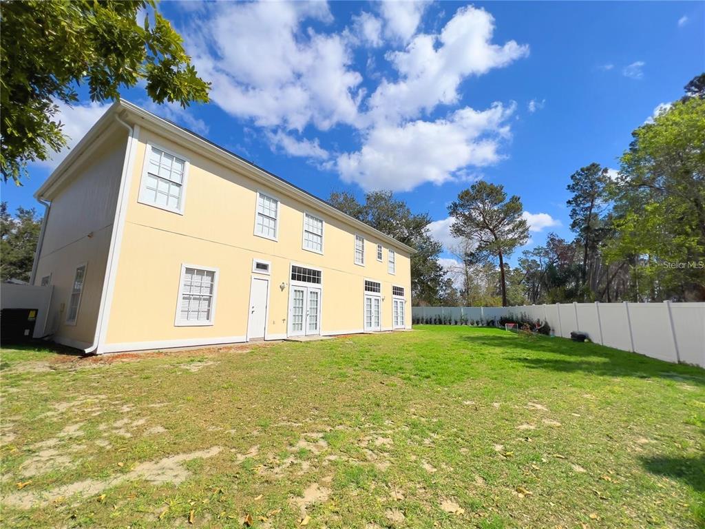 3273 Furlong Way Gotha, FL 34734 - Photo 34 of 38 a large house with a big yard and large trees