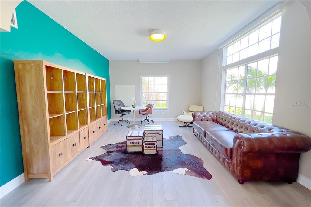 3273 Furlong Way Gotha, FL 34734 - Photo 4 of 38 a living room with furniture and a flat screen tv