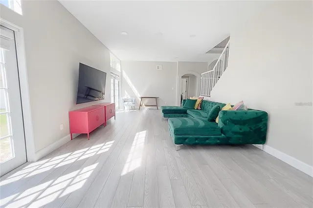 a living room with furniture and a flat screen tv