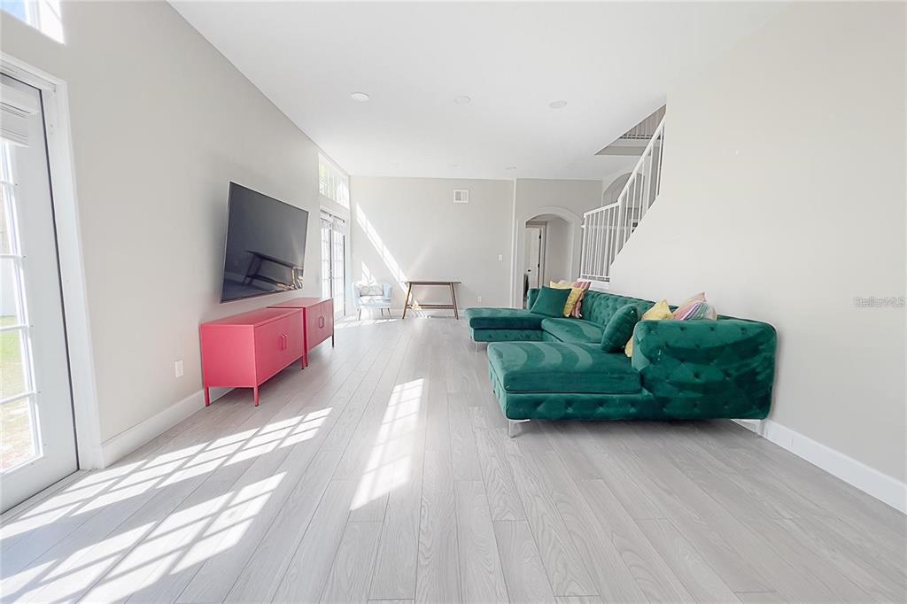 3273 Furlong Way Gotha, FL 34734 - Photo 6 of 38 a living room with furniture and a flat screen tv